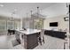 Modern kitchen with large island and stainless steel appliances at 3875 Grassland Loop, Lake Mary, FL 32746