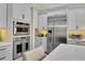 Modern kitchen with stainless steel appliances and white cabinets at 3875 Grassland Loop, Lake Mary, FL 32746