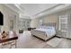 Spacious main bedroom with large bed and ample natural light at 3875 Grassland Loop, Lake Mary, FL 32746