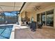 Covered patio with outdoor kitchen and seating area at 3875 Grassland Loop, Lake Mary, FL 32746