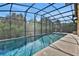 Inviting screened pool with a retractable awning at 3875 Grassland Loop, Lake Mary, FL 32746