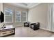 Bright sitting room with two leather armchairs at 3875 Grassland Loop, Lake Mary, FL 32746