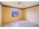 Simple bedroom with tile floors and a window at 79 Lake Villa Way, Kissimmee, FL 34743