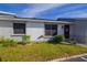 Front view of a condo with well-maintained landscaping at 79 Lake Villa Way, Kissimmee, FL 34743