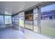 Bright Florida room with tile flooring and multiple windows at 79 Lake Villa Way, Kissimmee, FL 34743