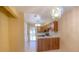 Kitchen with wood cabinets and access to outside at 79 Lake Villa Way, Kissimmee, FL 34743