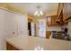 Simple kitchen with wood cabinets and appliances at 79 Lake Villa Way, Kissimmee, FL 34743