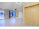Open living room with tile floors and access to the kitchen at 79 Lake Villa Way, Kissimmee, FL 34743