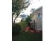 Landscaped backyard with mulch and privacy at 7947 Golden Pond Cir, Kissimmee, FL 34747