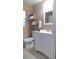 Bathroom with toilet, vanity, and storage at 7947 Golden Pond Cir, Kissimmee, FL 34747