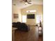 Spacious living room with hardwood floors and large windows at 7947 Golden Pond Cir, Kissimmee, FL 34747