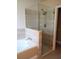 Large walk-in shower with glass enclosure at 7947 Golden Pond Cir, Kissimmee, FL 34747
