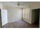 Spacious bedroom with ceiling fan and wood-look floors at 860 N Orange Ave # 118, Orlando, FL 32801