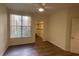 Bright bedroom with walk-in closet and wood floors at 860 N Orange Ave # 118, Orlando, FL 32801