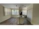 Bright dining area with hardwood floors and kitchen island at 860 N Orange Ave # 118, Orlando, FL 32801