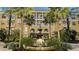 Condo building with fountain and tropical landscaping at 860 N Orange Ave # 118, Orlando, FL 32801