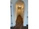 Bright hallway with wood-look floors and arched doorways at 860 N Orange Ave # 118, Orlando, FL 32801