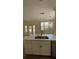 Modern kitchen featuring white cabinets and quartz countertops at 860 N Orange Ave # 118, Orlando, FL 32801