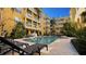 Community pool with lounge chairs at 860 N Orange Ave # 118, Orlando, FL 32801