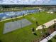 Aerial view showing community green space and lake at 8929 Amelia Downs Trl, Kissimmee, FL 34747