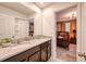 Double vanity bathroom with a view to a bedroom at 8929 Amelia Downs Trl, Kissimmee, FL 34747