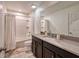 Bathroom with tub, shower, and dark brown vanity at 8929 Amelia Downs Trl, Kissimmee, FL 34747
