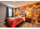 Charming bedroom with a London-themed mural and mid-century furniture at 8929 Amelia Downs Trl, Kissimmee, FL 34747