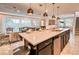 Modern kitchen island with a breakfast bar and stainless steel appliances at 8929 Amelia Downs Trl, Kissimmee, FL 34747
