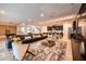 Spacious living room with a large sectional sofa and a view into the kitchen at 8929 Amelia Downs Trl, Kissimmee, FL 34747