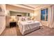 Bright main bedroom with a plush bed and a textured wall feature at 8929 Amelia Downs Trl, Kissimmee, FL 34747