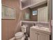 Stylish powder room with a white vanity and a large mirror at 8929 Amelia Downs Trl, Kissimmee, FL 34747