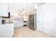 Modern kitchen featuring stainless steel appliances and white cabinetry at 11825 Cranbourne Dr, Orlando, FL 32837