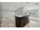 Open kitchen island with granite countertops and dark brown cabinets at 1731 Durden Dr, Winter Haven, FL 33880