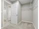 Spacious walk-in closet with wire shelving and neutral carpeting at 1731 Durden Dr, Winter Haven, FL 33880