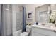 Clean bathroom with a tub shower combo and vanity at 1972 Tamarack Rd, Davenport, FL 33837