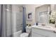 Clean bathroom with a tub shower combo, vanity, and white cabinets at 2211 Longleaf Rd, Davenport, FL 33837