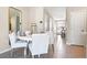 Bright dining area with white round table and chairs near kitchen at 2211 Longleaf Rd, Davenport, FL 33837
