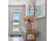 Bright and airy entryway with console table, mirror, and pampas grass at 2211 Longleaf Rd, Davenport, FL 33837