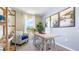 Bright home office with built-in shelving and a comfortable armchair at 2211 Longleaf Rd, Davenport, FL 33837