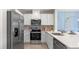 Modern kitchen with stainless steel appliances and white cabinets at 2211 Longleaf Rd, Davenport, FL 33837