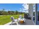 Private patio with seating area, overlooking a grassy backyard at 2211 Longleaf Rd, Davenport, FL 33837