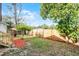 Large backyard with wooden fence and trees at 2216 Greenview Cir, Orlando, FL 32808