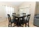 Small dining area with four chairs adjacent to the kitchen at 5200 Sunset Canyon Dr, Kissimmee, FL 34758