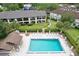 Aerial view of community pool, building exteriors, and surrounding landscape at 600 Northern Way # 1608, Winter Springs, FL 32708