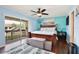 Spacious bedroom with wood flooring and access to a private balcony at 600 Northern Way # 1608, Winter Springs, FL 32708