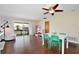 Bright dining area with hardwood floors and access to a balcony at 600 Northern Way # 1608, Winter Springs, FL 32708