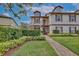 Two-story condo with landscaped walkway and manicured lawn at 600 Northern Way # 1608, Winter Springs, FL 32708