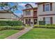 Two-story condo featuring a balcony and landscaped front yard at 600 Northern Way # 1608, Winter Springs, FL 32708