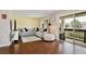 Spacious living room with hardwood floors and access to a balcony at 600 Northern Way # 1608, Winter Springs, FL 32708