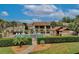 Community pool with lounge chairs and a shaded seating area at 600 Northern Way # 1608, Winter Springs, FL 32708